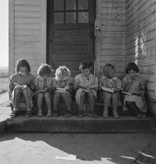 Girls of Lincoln Bench School study their reading lesson, near Ontario, Malheur County, Oregon, 1939 Creator: Dorothea Lange