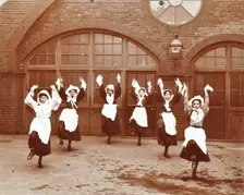 Girls morris dancing in playground, Thomas Street Girls School, Limehouse, Stepney, London, 1908
