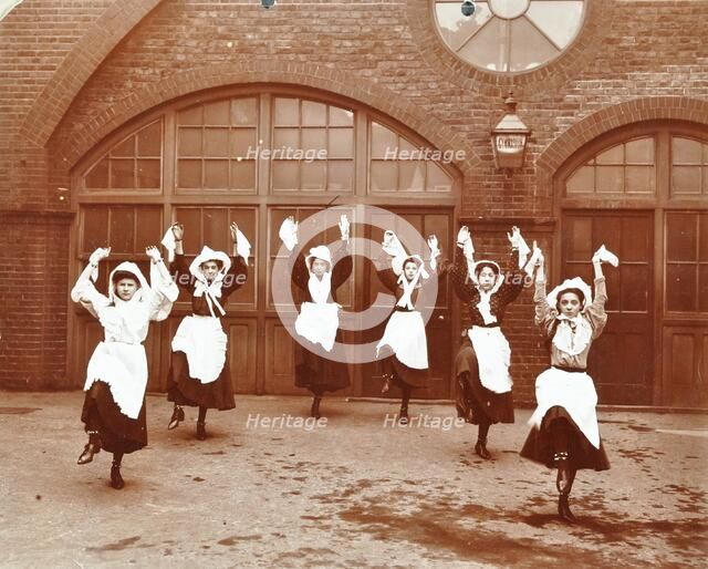 Girls morris dancing in playground, Thomas Street Girls School, Limehouse, Stepney, London, 1908. Artist: Unknown.