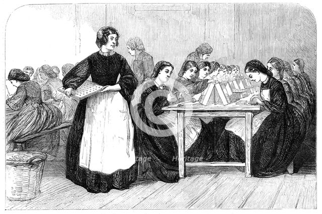 Girls making cartridges for Enfield rifles at the Royal Arsenal, Woolwich, 1862. Creator: Unknown.