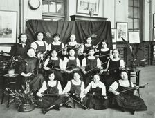 Girls swimming championship team with their shield, Tollington Park Central School, London, 1915