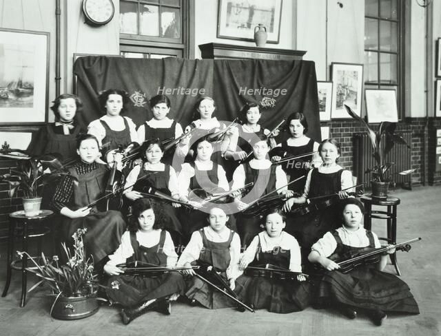 Girls swimming championship team with their shield, Tollington Park Central School, London, 1915. Artist: Unknown.