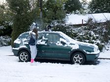 Girls palying with snowballs by VW Golf 2009