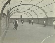 Girls playing netball on a roof playground, Barrett Street Trade School, London, 1927