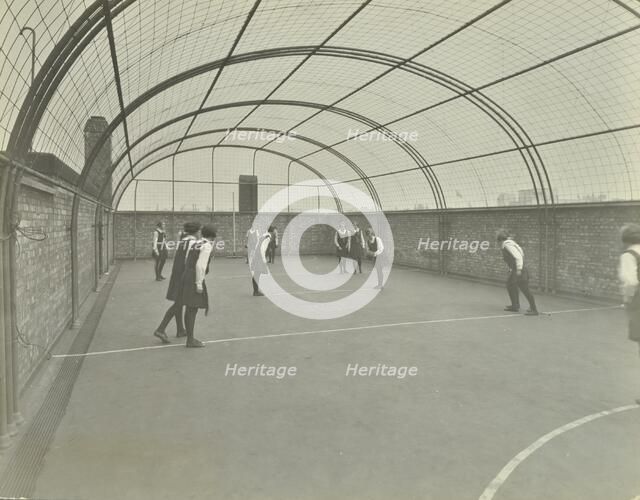 Girls playing netball on a roof playground, Barrett Street Trade School, London, 1927. Artist: Unknown.