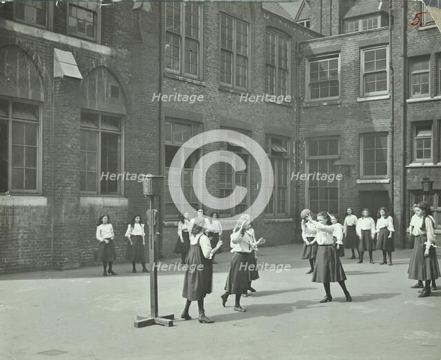 Girls playing netball in the playground, William Street Girls School, London, 1908. Artist: Unknown.