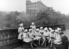 Girls read in an outdoor class, Rowntree factory, York, Yorkshire, 1933