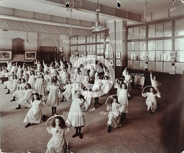 Girls with hoops, Lavender Hill Girls School, Bermondsey, London, 1906. Artist: Unknown.