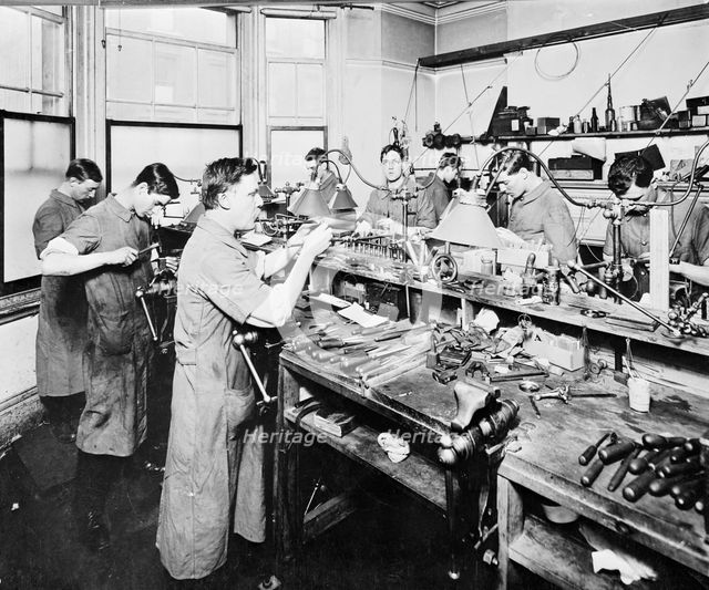 Glass lens manufacturing workshop, 1910.  Creator: Unknown.