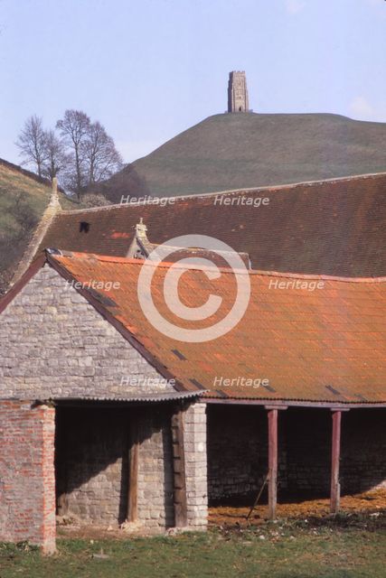 GlastonburyTor and ancient Tithebarn in foreground, Somerset, 20th century. Artist: CM Dixon.