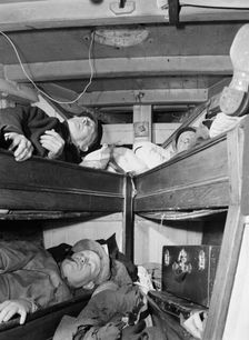 Gloucester fishermen resting in their bunks after unloading their catch at the..., New York, 1943. Creator: Gordon Parks
