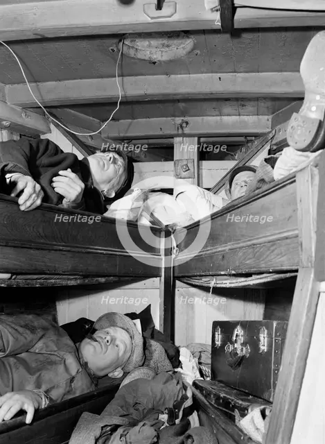 Gloucester fishermen resting in their bunks after unloading their catch at the..., New York, 1943. Creator: Gordon Parks.