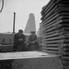 Gloucester fishermen resting on their boat at the Fulton fish market, New York, 1943. Creator: Gordon Parks