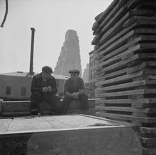 Gloucester fishermen resting on their boat at the Fulton fish market, New York, 1943. Creator: Gordon Parks