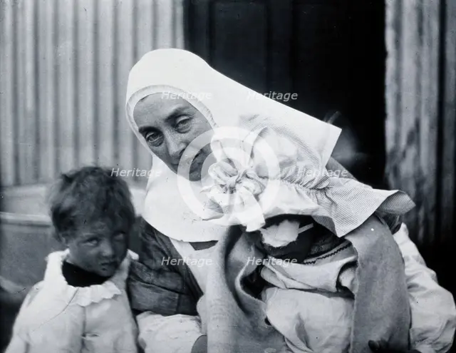 Gloucester smallpox epidemic, 1896: Elsie Clutterbuck (right), a smallpox patient, with..., 1896. Creator: HCF of Gloucester.