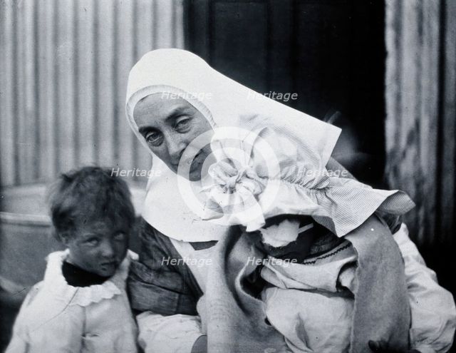 Gloucester smallpox epidemic, 1896: Elsie Clutterbuck (right), a smallpox patient, with..., 1896. Creator: HCF of Gloucester.