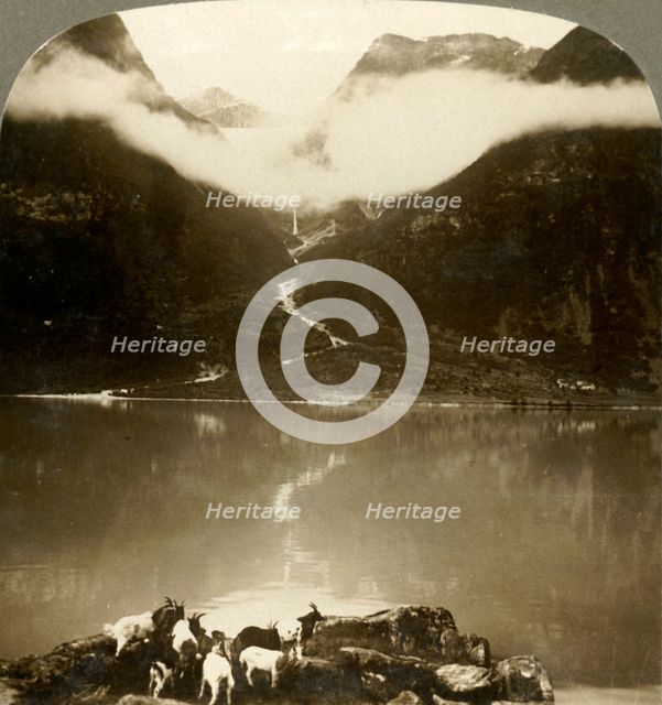 'Grytereids glacier glittering above drifting clouds,  across placid Lake Olden, Norway', c1905. Creator: Unknown.