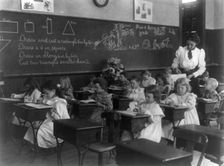 Grade school, Washington, D.C. - children drawing and cutting rectangles, triangles, etc., (1899?). Creator: Frances Benjamin Johnston
