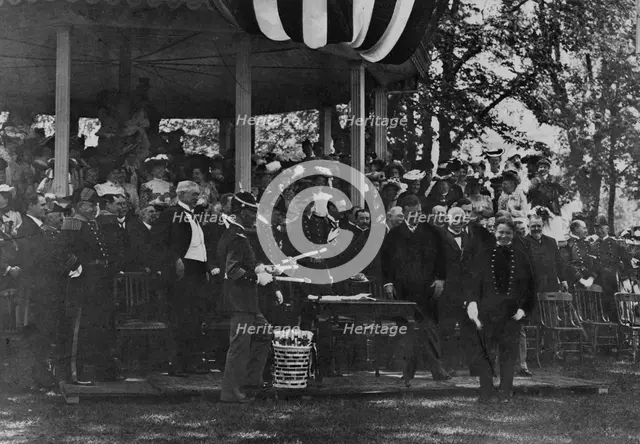 Graduation Day at Annapolis - cadet receiving his diploma from President Theodore Roosevelt, 1902. Creator: Frances Benjamin Johnston.