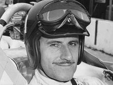 Graham Hill in cockpit of Lola T90, Indianapolis, 1966
