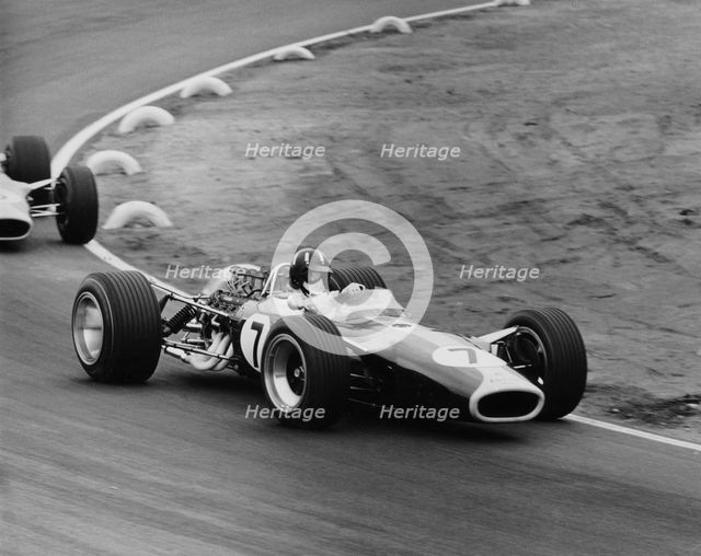 Graham Hill in a Lotus 49, French Grand Prix, Le Mans, 1967. Artist: Maxwell Boyd