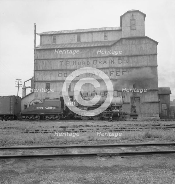 Grain elevator along railroad yard, North Platte, Nebraska, 1939. Creator: Dorothea Lange.