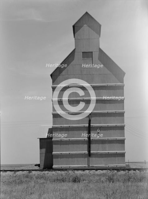 Grain elevator on the Texas Panhandle plains, Everett, Texas, 1938. Creator: Dorothea Lange.