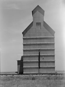 Grain elevator on the Texas Panhandle plains, Everett, Texas, 1938. Creator: Dorothea Lange
