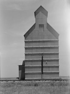 Grain elevator on the Texas Panhandle plains, Everett, Texas, 1938. Creator: Dorothea Lange