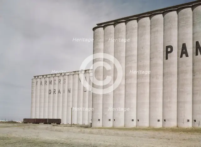 Grain elevators near Amarillo, Texas; Santa Fe trip, 1943. Creator: Jack Delano.