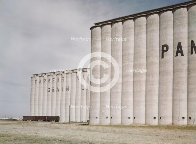 Grain elevators near Amarillo, Texas; Santa Fe trip, 1943. Creator: Jack Delano.