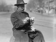 Grand Army of The Republic - G.A.R. Emblem Carved in Wood By Switchman at Peace Monument, 1917. Creator: Harris & Ewing