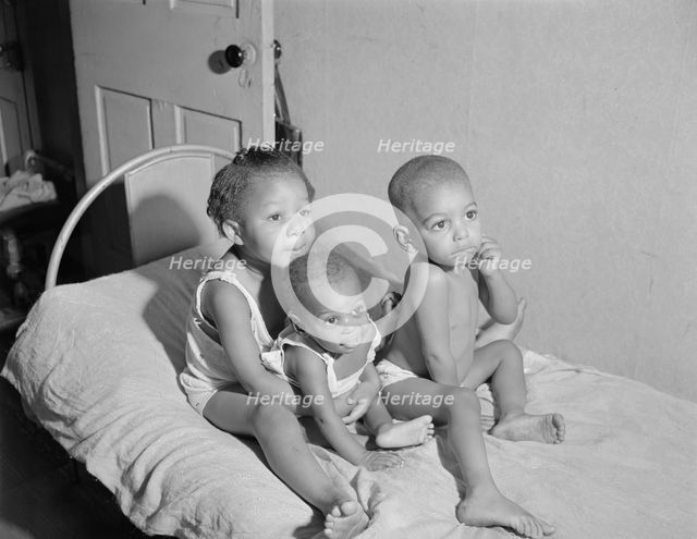 Grandchildren of Mrs. Ella Watson, a government charwoman, Washington, D.C., 1942. Creator: Gordon Parks.