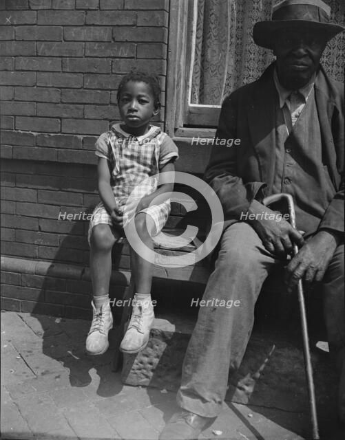 Grandfather and grandchild who live on Seaton Road, Washington, D.C, 1942. Creator: Gordon Parks.