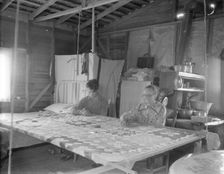 Grandmother from Oklahoma with grandson, working on quilt, California, Kern County, 1936. Creator: Dorothea Lange
