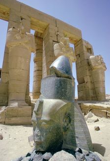 Granite head of Rameses II in front of the Ramesseum, Luxor (Thebes), Egypt. Creator: Tony Evans