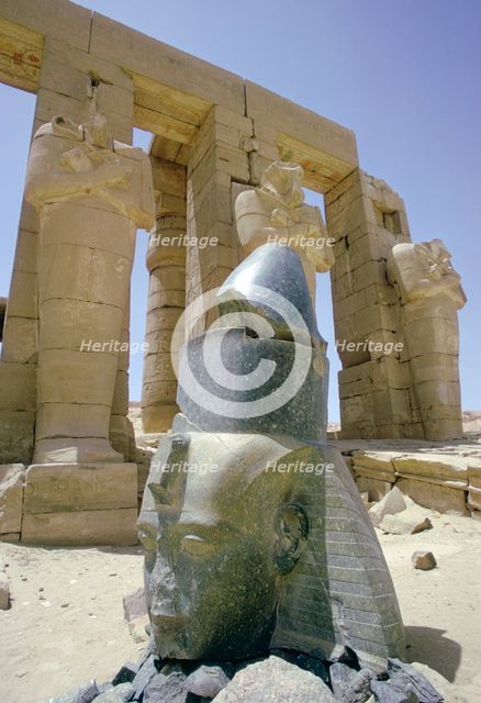 Granite head of Rameses II in front of the Ramesseum, Luxor (Thebes), Egypt. Creator: Tony Evans.