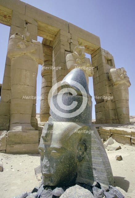 Granite head of Rameses II in front of the Ramesseum, Luxor (Thebes), Egypt. Artist: Tony Evans