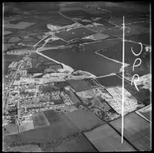 Gravel extraction and new water filled gravel pits, South Cerney, Gloucestershire, 1973. Creator: Aerofilms
