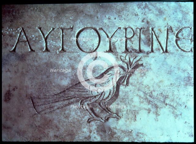 Gravestone with the figure of a dove or a sparrow in the Catacombs of San Calixtus.