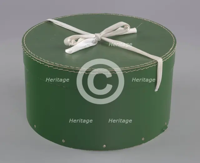 Green circular hatbox with lid from Mae's Millinery Shop, 1941-1994. Creator: Unknown.