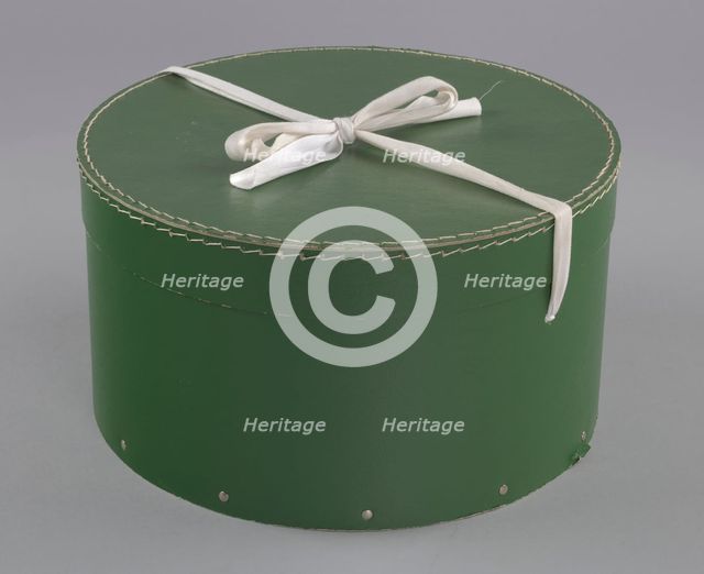 Green circular hatbox with lid from Mae's Millinery Shop, 1941-1994. Creator: Unknown.