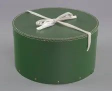 Green circular hatbox with lid from Mae's Millinery Shop, 1941-1994. Creator: Unknown