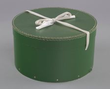 Green circular hatbox with lid from Mae's Millinery Shop, 1941-1994. Creator: Unknown