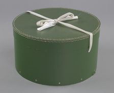 Green circular hatbox with lid from Mae's Millinery Shop, 1941-1994. Creator: Unknown