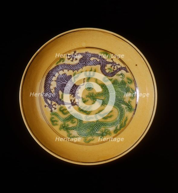 Green and aubergine dragons on yellow ground saucer, Guangxu period, Qing dynasty, China, 1875-1908. Artist: Unknown