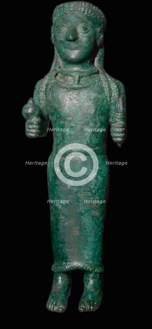 Greek bronze figure holding a pomegranate. Artist: Unknown