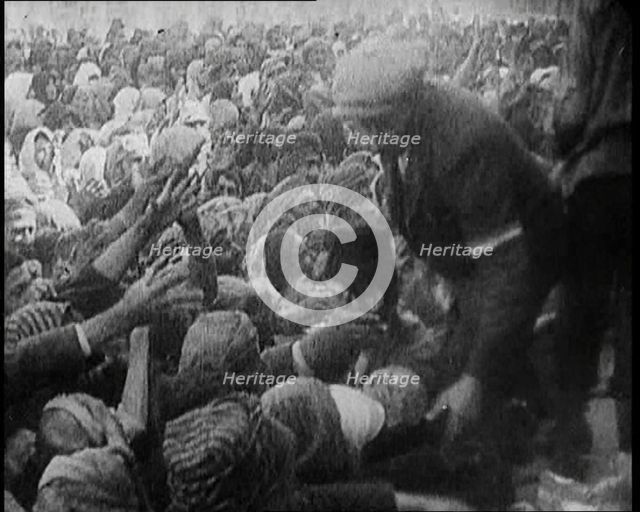 Greek People Jostling for Red Cross Food Hand Outs, 1922. Creator: British Pathe Ltd.