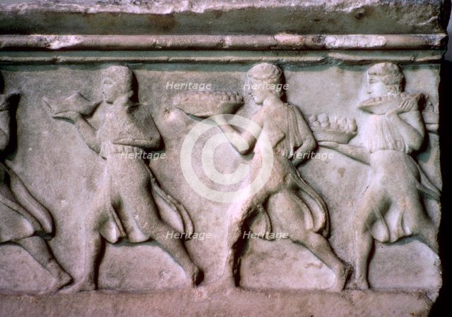 Greek relief of servants carrying food. Artist: Unknown