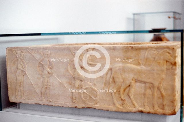 Greek warrior stepping into his chariot, c400 BC. Artist: Anon